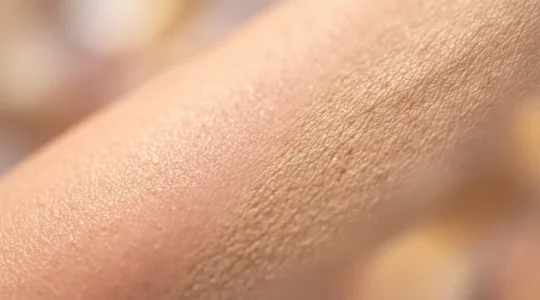 Artistic representation of skin's collagen transformation from youthful firmness to mature texture